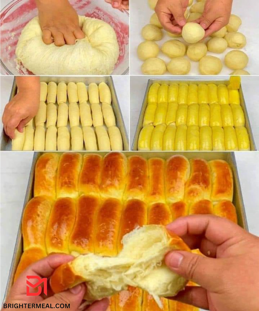 Freshly baked loaf of bread with a golden crust, sliced and topped with melted butter