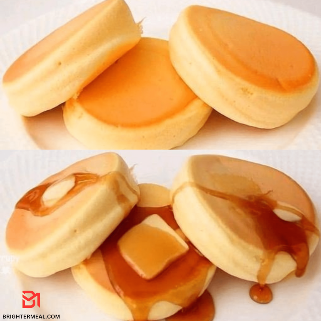 A stack of golden-brown pancakes topped with syrup and fresh berries, ready to be enjoyed for breakfast.